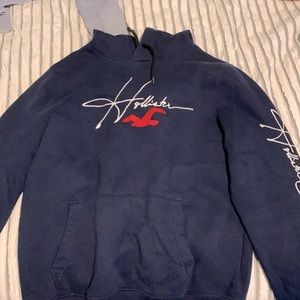 Loose/tight fit dark blue Hollister hoodie.